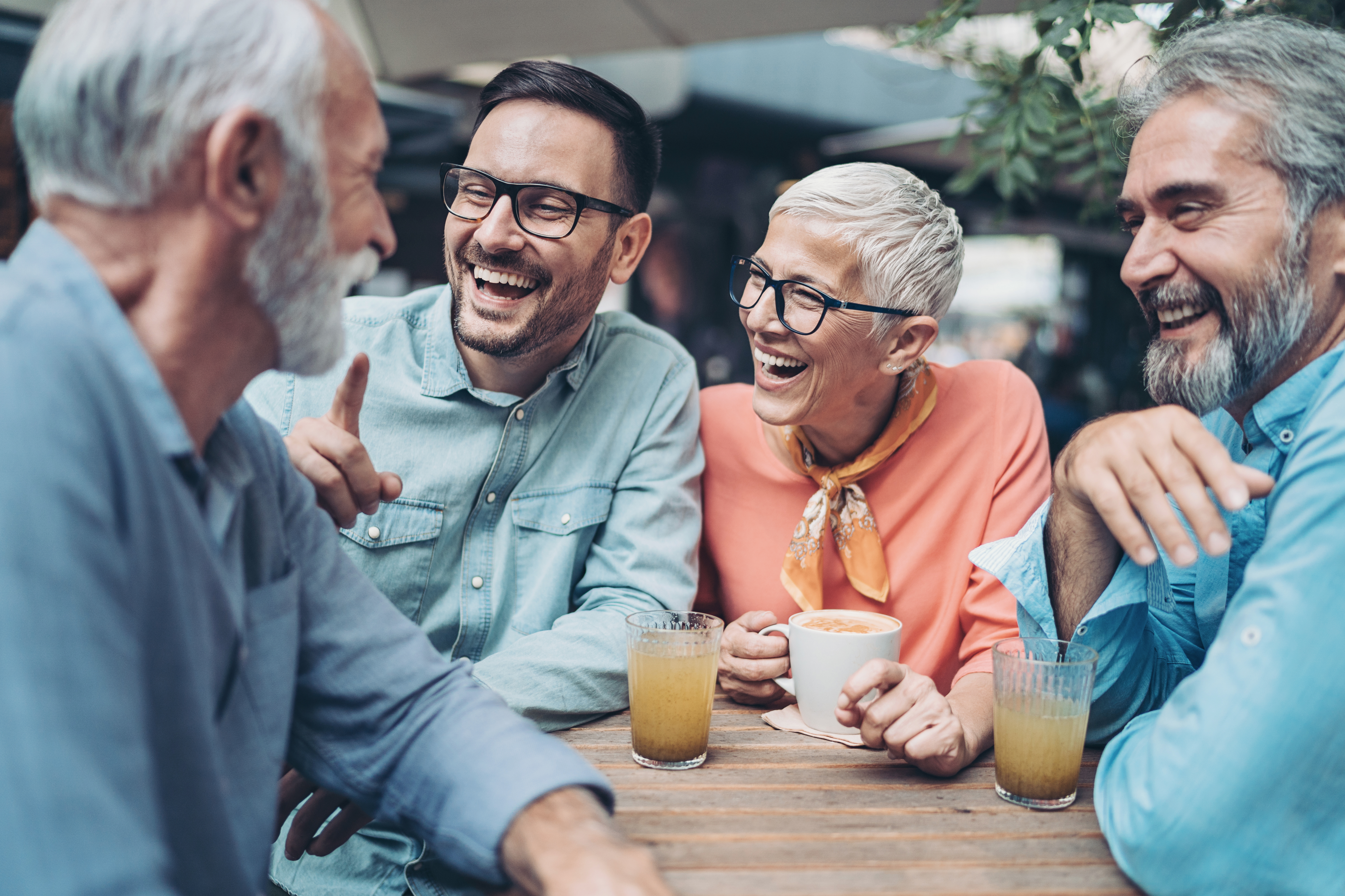 people laughing with drinks
