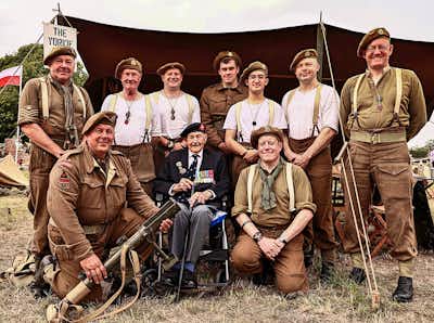 WW2 re-enactors with a war veteran at The Victory Show 2024